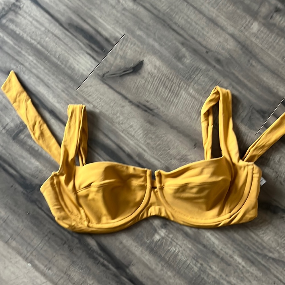 Mustard yellow Lspace swim top. Adjustable straps and back.